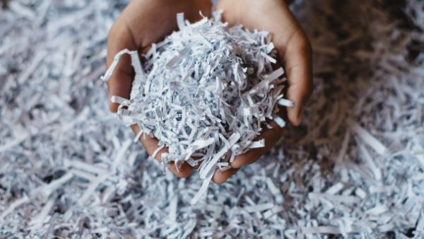 hand holding shredded paper